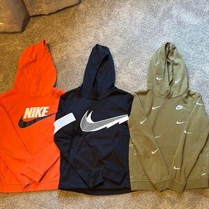 Orange w/ black swoosh, black w/ white swoosh, olive green w/multiple swooshes